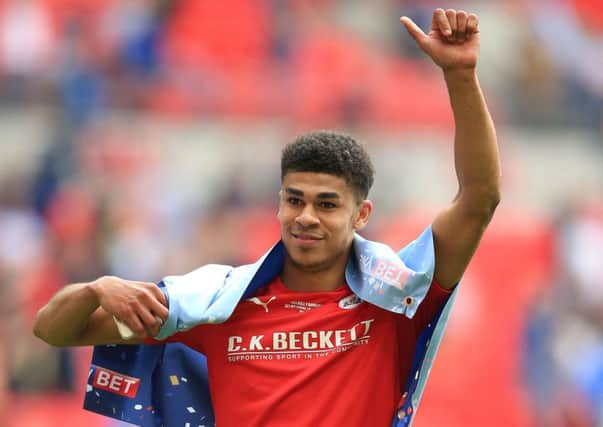 Barnsley's Ashley Fletcher, pictured celebrating after the final whistle in the Sky Bet League One Play-Off Final at Wembley Stadium, is a target for Leeds.