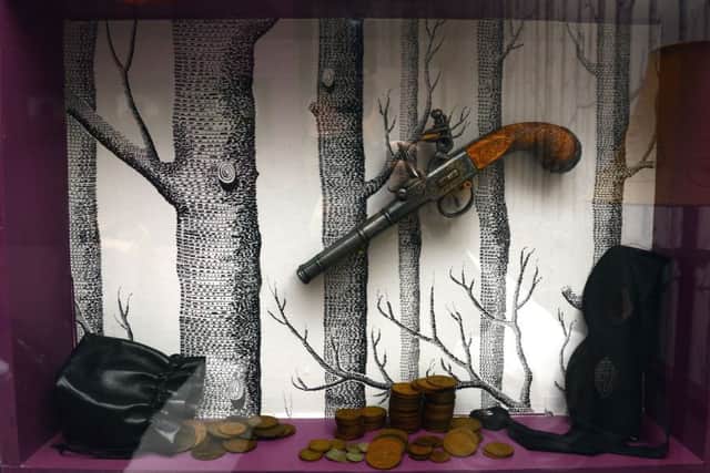 The Dick Turpin bedroom with diorama made from the old serving hatch - complete with repilica pistol, mask and coins