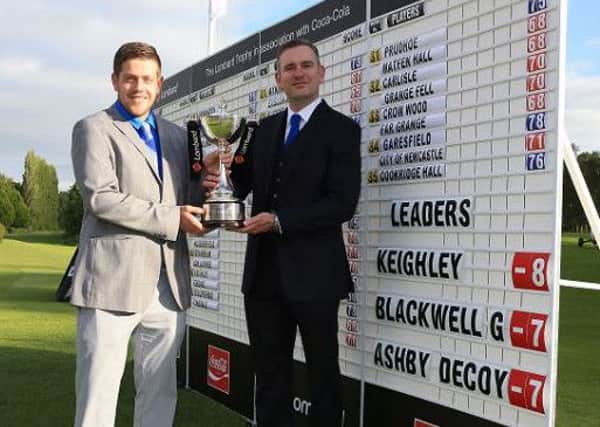 Keighley's professional Andrew Rhodes, right, and Luke Roberts after their victory at Fulford.