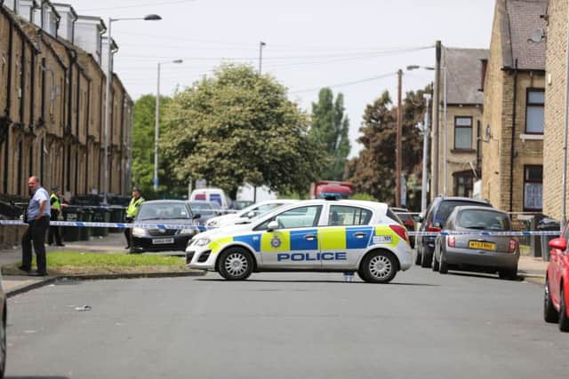 Police at the scene of the fatal shooting on Round Street, West Bowling, Bradford. Picture: Ross Parry Agency
