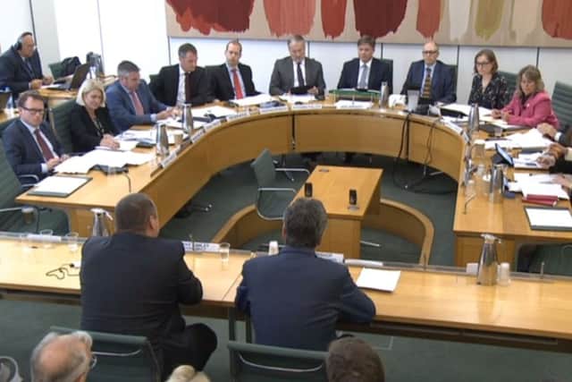 Sports Direct boss Mike Ashley (left) gives evidence to the Business, Innovation and Skills Committee
