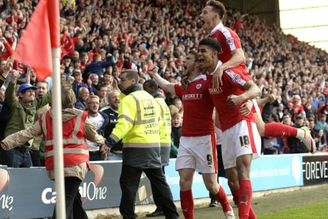 Sam Winnall celebrates his first goal with Josh Fletcher and Josh Brownhill.
Barnsley v Walsall. SkyBet League 1 Play-off semi final 1st leg. Oakwell.  14 May 2016.  Picture Bruce Rollinson