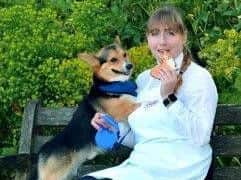 Emma Bulmer from Bettys with the Corgi biscuits and the real Buddy the Corgi.