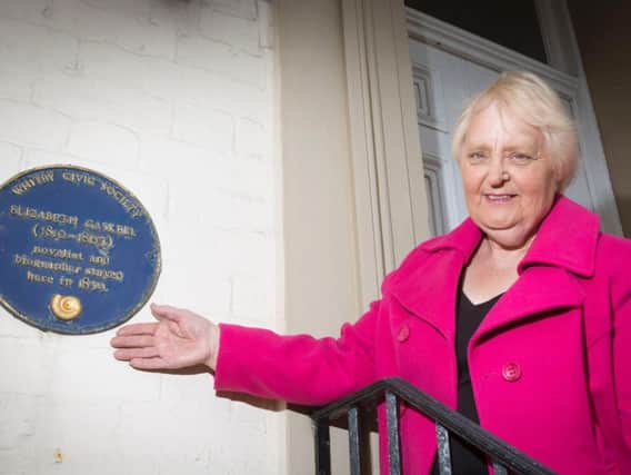 Elizabeth Cheyne with one of Whitby's blue plaques
