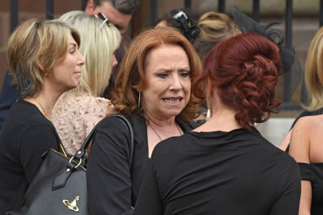 Melanie Hill (centre) leaves Liverpool Cathedral following the funeral of television comedy writer Carla Lane