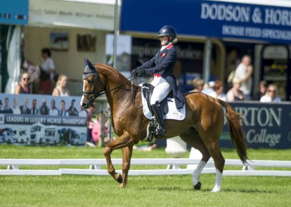 Holly Woodhead, on DHI Lupison, at Bramham.