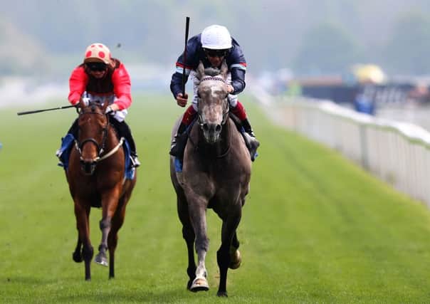 Magical Memory ridden by Frankie Dettori (right) wins The Duke of York Clipper Logistics Stakes.