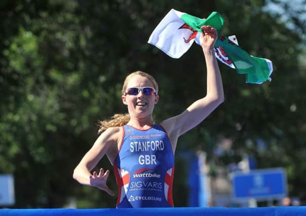 Adopted Yorkshire lass Non Stanford celebrates crossing the line first at the World Triathlon Series race in Madrid in 2013, the year she won the world title