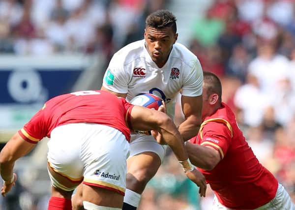 England's Luther Burrell (centre) looks to break through the Welsh line two weeks ago.