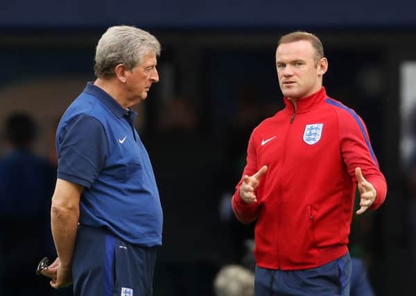 England's captain Wayne Rooney explains a point to manager Roy Hodgson during the squad's walk around the Stade Velodrome, Marseille last night (Picture: Owen Humphreys/PA Wire).