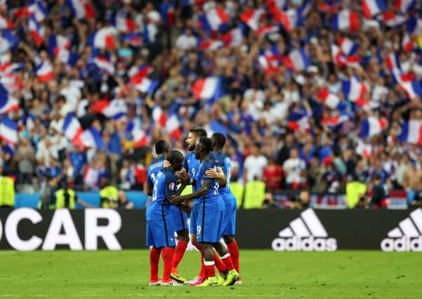 France celebrate at the end of the match.