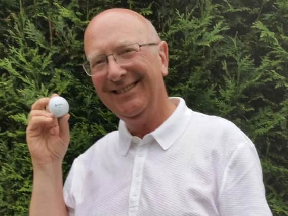 Wortley's John Royston with a ball he suspects may have 'special powers' after he scored two holes-in-one with it in just over a week.