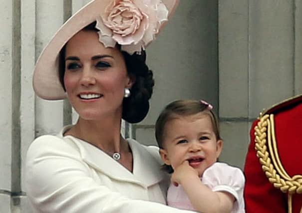 The Duchess of Cambridge with Princess Charlotte on the balcony at Buckingham Palace today