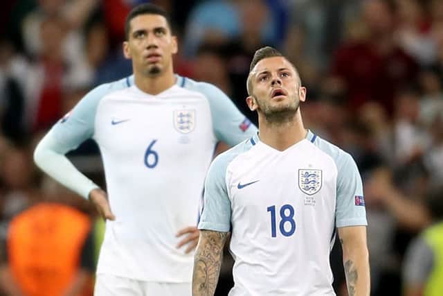 England's Chris Smalling (left) and Jack Wilshere stand dejected during the UEFA Euro 2016, Group B match at the Stade Velodrome, Marseille.
