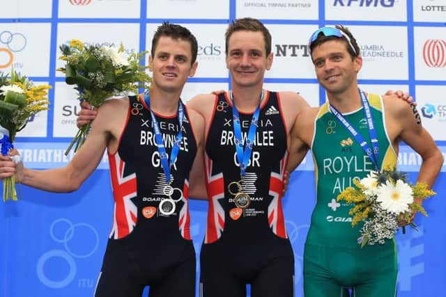 Gold medalist Great Britain's Alistair Brownlee (centre), silver medalist Great Britain's Jonathan Brownlee (left) and bronze medalist Australia's Aaron Royle (right) after competing in the Elite Men's ITU World Triathlon Series in Leeds.