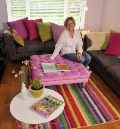 Colour is a defining feature in Jo's home. The silk fabric that she used to make the cushions is from James Hare