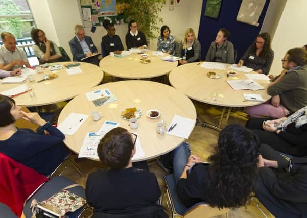 Successful grant applicants discuss their findings at the St Georges Centre in Leeds. Picture by James Hardisty.