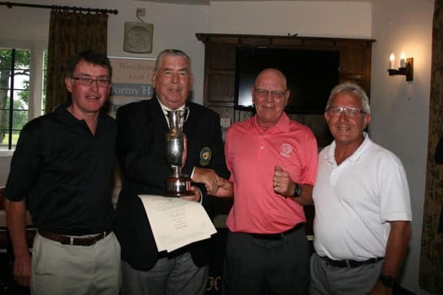 Huddersfield, winners of the Geoff Horrocks Trophy at the HHDUGC seniors championship, l-r: Robin Marchant, the union's president Stuart Naylor, John Oxley and Allen Humphries.
