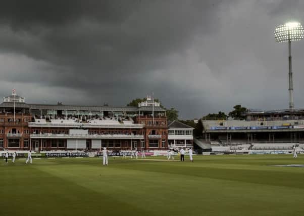 The floodlights are switched on as play begins during day five of the Investec Third Test match at Lord's, London.
