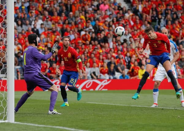 Spain's Gerard Pique scores the only goal of the game against Czech Republic  in Toulouse (Picture: Manu Fernandez/AP).