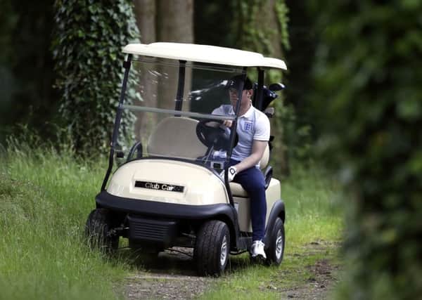 England captain Wayne Rooney drives a buggy during a round of golf at the Club du Lys Chantilly (Picture: Owen Humphreys/PA Wire).