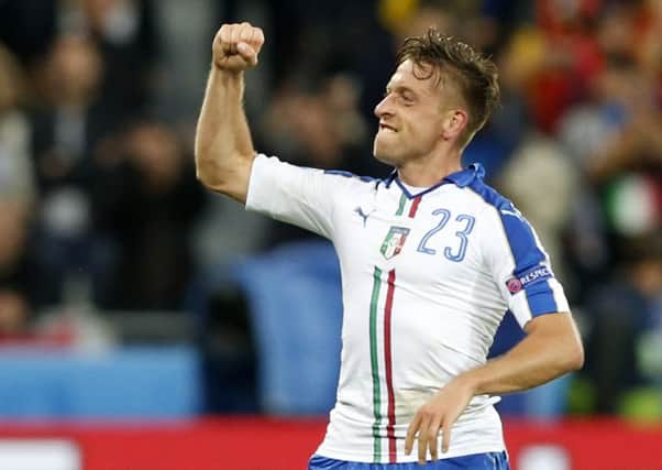 Italy's Emanuele Giaccherini celebrates after scoring his side's first goal against Belgium (Picture: Antonio Calanni/AP).