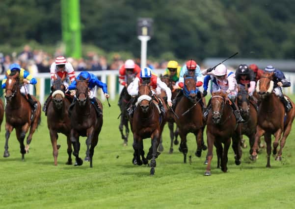 Profitable, ridden by jockey Adam Kirby, centre, on his way to winning the Kings Stand Stakes during day one of Royal Ascot  (Picture: David Davies/PA Wire)