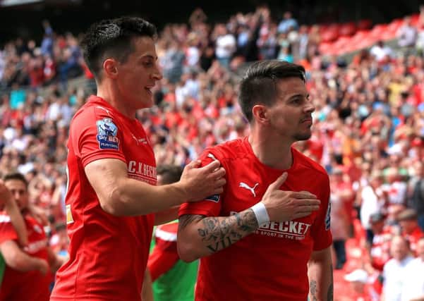 Barnsley's Adam Hammill, right, celebrates scoring his side's second goalin the League One Play-Off Final at Wembley (Picture: Nick Potts/PA Wire).