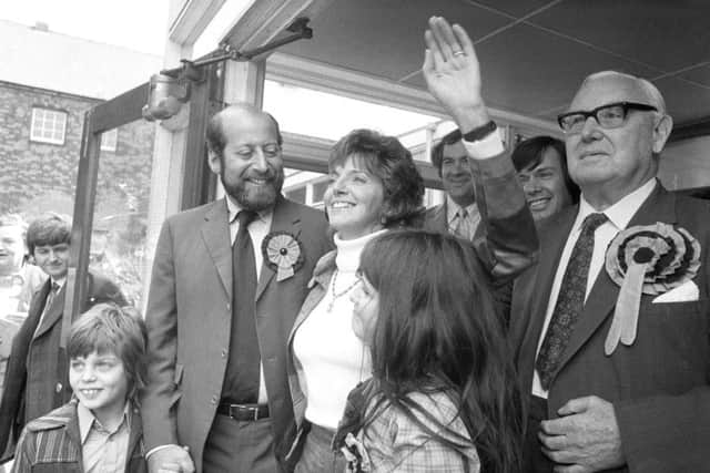 Clement Freud smiling as his wife Jill waves to supporters after his victory for the Liberals in the Isle of Ely by-election in 1973