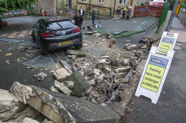 St Matthias C of E Primary School on Burley Road, Leeds, where a Vauxhall Astra crashed through the school fence and came to a rest in the children's playground at around 5am this morning. Picture: Ross Parry Agency