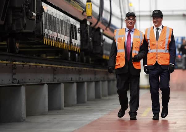 Chancellor George Osborne (right) and former Chancellor Alistair Darling at a pro-Remain event at the Hitachi Rail Europe plant in Ashford, Kent.