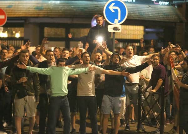England fans chant in Lille city centre, France, as fresh clashes have taken place between England fans and Russian hooligans at Euro 2016. Pictures: Niall Carson/PA Wire