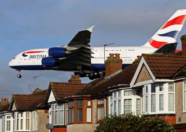 A British Airways Airbus A380 plane lands over houses in Myrtle Avenue near Heathrow Airport. PIC: PA
