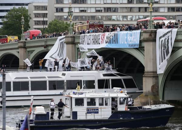 A boat carrying Bob Geldof takes part in a pro-EU counter demonstration, as a Fishing for Leave pro-Brexit "flotilla" makes its way along the River Thames in London.