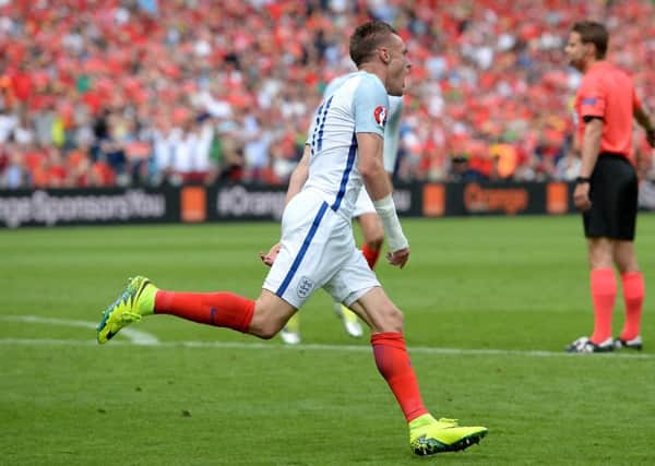 Jamie Vardy wheels away in celebration after drawing England level against Wales in the crucial Group B match at Euro 2016