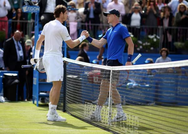 Great Britain's Andy Murray (left) shakes hands with Beverley's Kyle Edmund after winning. Picture: Steve Paston/PA