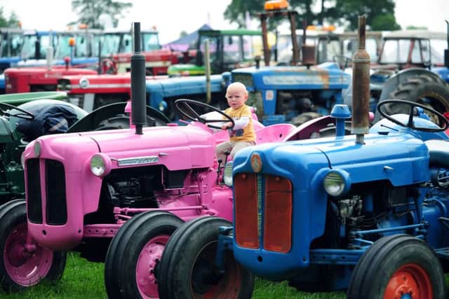 Fourteen-month-year-old Seth Whitelaw from Northallerton has a ride on a tractor.