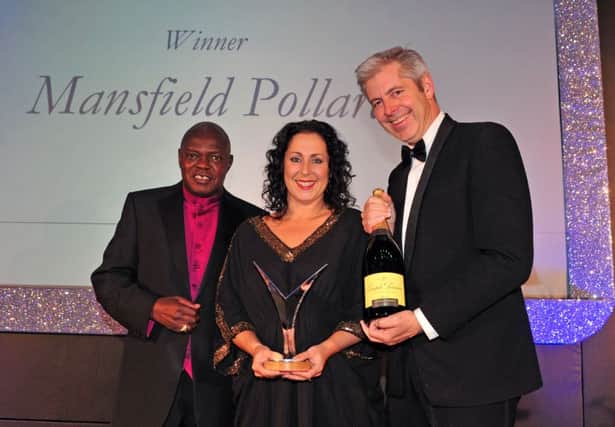 14 October 2015.......  Joanna Robinson of Mansfield Pollard recieves the Employer of the Year award from Archbishop Dr John Sentamu and Justin Webb at the Yorkshire Post Excellence in Business awards at The Queens Hotel  in Leeds. Picture Tony Johnson