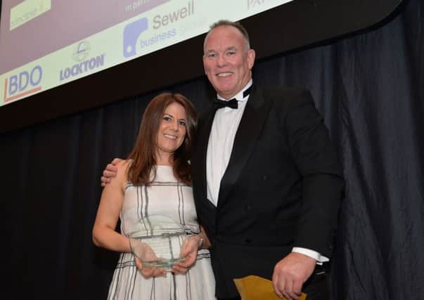 Andy Finneran presents the Outstanding Achievement Award 2015 to Victoria Woodings of Principle Group at the Yorkshire Finance Director Awards at Aspire, Leeds. Picture: Anna Gowthorpe