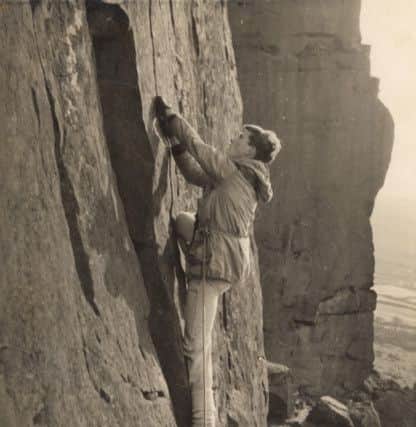 Mark Vallance climbing Avalanche Wall at Curbar in 1960. Note the gym shoes.