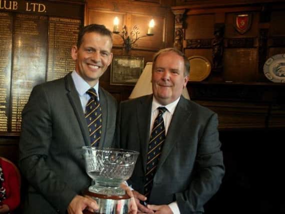 Jonathan Wass, winner of the Captain's Weekend prize, with Woodsome Hall's captain James Crowther.