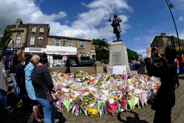 Flowers laid for Jo Cox MP, at Birstall Market Place. Picture by Simon Hulme