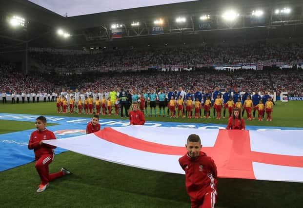 No-one was copmplaining about the size of the flag when England players lined up to sing the national anthem before the Slovakia match last night