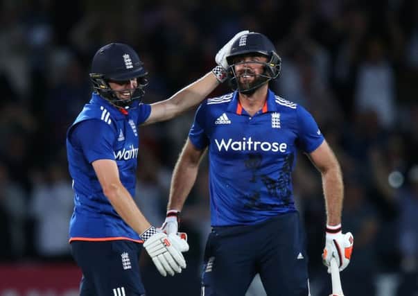 England's Liam Plunkett, right, and Chris Woakes celebrate tieing the match off the last ball against Sri Lanka at Trent Bridge (Picture: Simon Cooper/PA Wire).