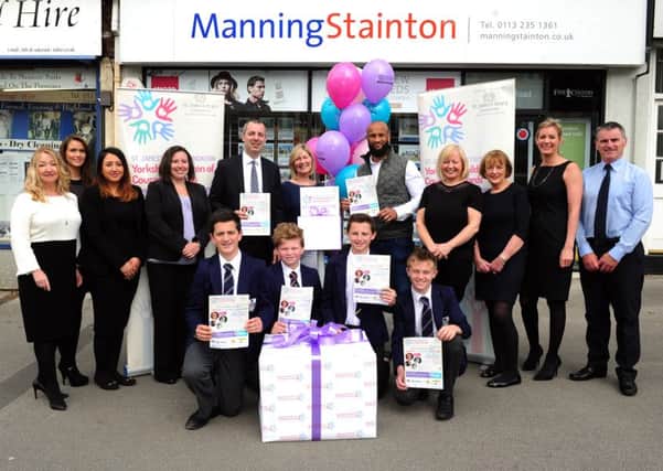 Fundraisers and supporters of the Yorkshire Children of Courage Awards join Leeds Rhinos star Jamie Jones-Buchanan at Leeds estate agent Manning Stainton, to rally members of the public to nominate brave and courageous children for a Yorkshire Children of Courage Award. Picture : Jonathan Gawthorpe