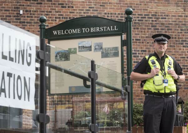 A police officer stands outside a polling station being used in the EU referendum at Birstall library, West Yorkshire, near where Labour MP Jo Cox was attacked and killed outside her constituency surgery.