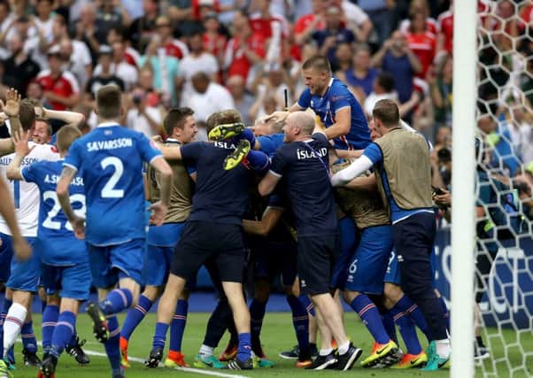Iceland players celebrate their late winner and qualifying for the last 16 round after the Euro 2016, Group F match at the Stade de France, Paris. (Picture: Owen Humphreys/PA Wire).