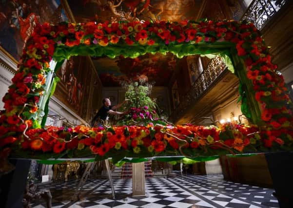 Floral designer Jonathan Moseley puts the finishing touches to Florabundance flower show at Chatsworth.
Picture Scott Merrylees