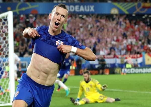 Croatia's Ivan Perisic celebrates after scoring his side's second goal during the Euro 2016 Group D soccer match between Croatia and Spain. (AP Photo/Hassan Ammar)