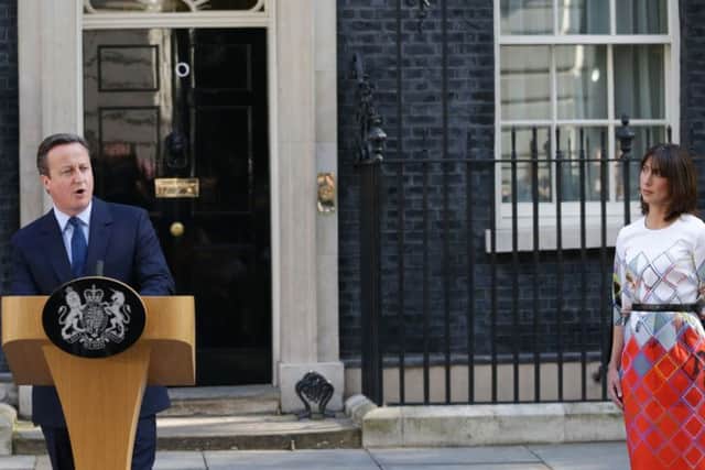 David Cameron speaks outside Downing St watched by wife Samantha